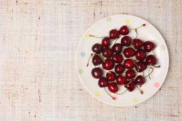 Fresh red cherries in a bowl