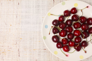 Fresh red cherries in a bowl