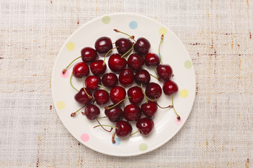 Fresh red cherries in a bowl