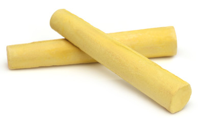 Yellow chalk over white background