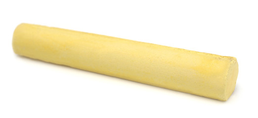 Yellow chalk over white background