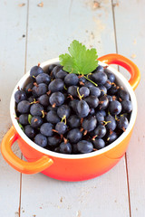 Fresh gooseberries in ceramic bowl