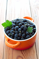 Fresh gooseberries in ceramic bowl