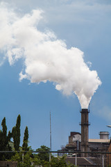 Industrial smoke from chimney to sky