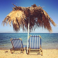 Sunbeds with umbrella on the beach