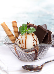 Ice cream scoops on wooden table.