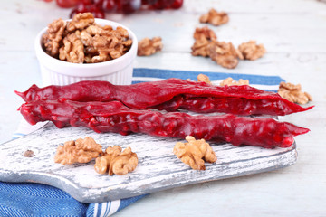 Tasty oriental sweets (churchkhela) and fresh nuts,