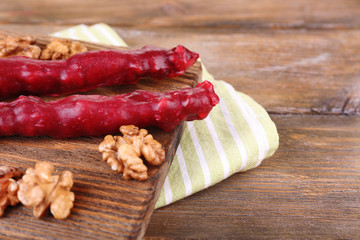 Tasty oriental sweets (churchkhela) and fresh nuts,