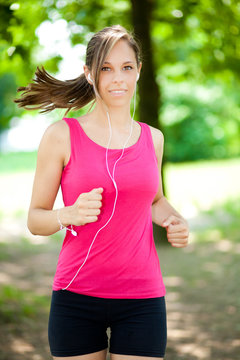 Young woman running at the park
