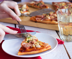 pizza with sausage, chicken, corn and cheese