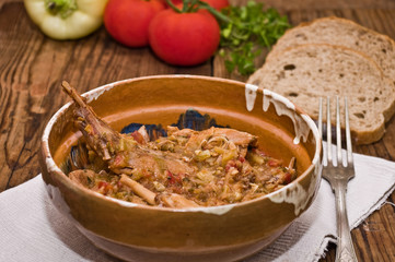 Rabbit stew served in romanian traditional earthenware