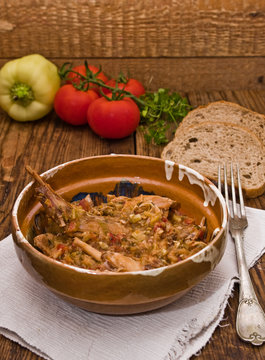 Rabbit stew served in romanian traditional earthenware