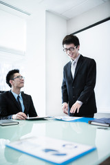 Businessman standing in front of colleagues during a meeting