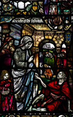 Wonder of Jesus in stained glass: helping a cripple