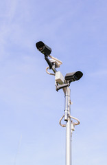 CCTV security camera on  blue sky