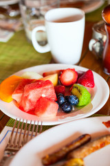 Breakfast with fresh fruits and coffee