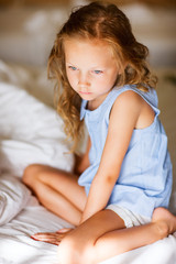 Obraz na płótnie Canvas Sweet little girl in light blue pajama