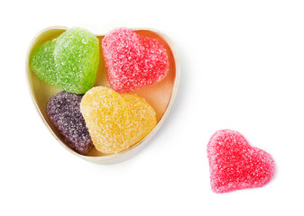 Colorful heart shaped candies in a wooden heart box
