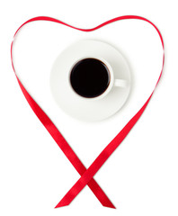 Coffee cup with a heart shaped ribbon around