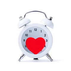 Classic alarm clock with a heart inside