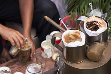 merchants making coffee on his boat in the floating Market