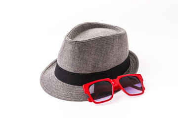 Hat , sunglasses isolated on white