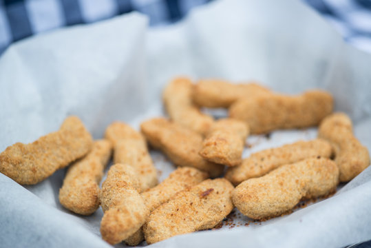 Hot cooked chicken goujon in breadcrumbs for lunch