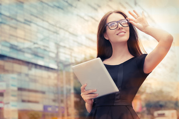 Young Woman with Tablet Out in the City