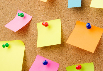 Empty pinned notes on corkboard isolated