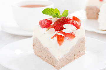 piece of cake with whipped cream and strawberries
