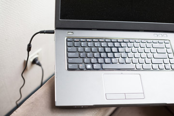 Obraz na płótnie Canvas charging laptop