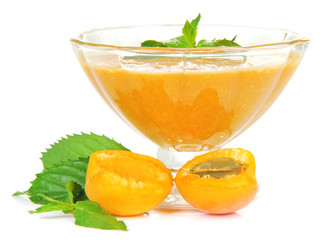 Apricot jam in glass bowl and fresh apricots, isolated on white