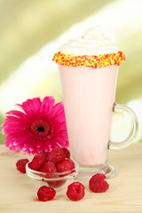Delicious milk shake on table on light background