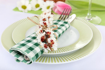 Table setting with spring flowers close up