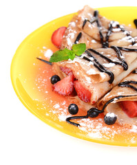 Delicious pancakes with berries isolated on white