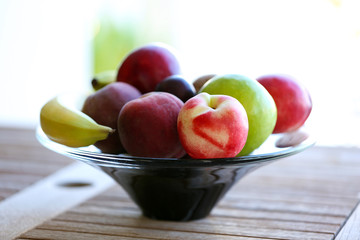 Juicy fruits on wooden table, close-up