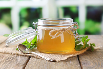 Homemade mint jelly in glass jar,