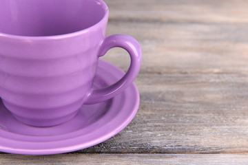 Cup and saucer on wooden background