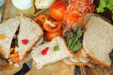 making tuna sandwich with fresh vegetables