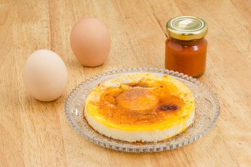 fried egg with tomato Sauce on crystal dish