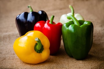 Red, green, black, white and yellow bell peppers