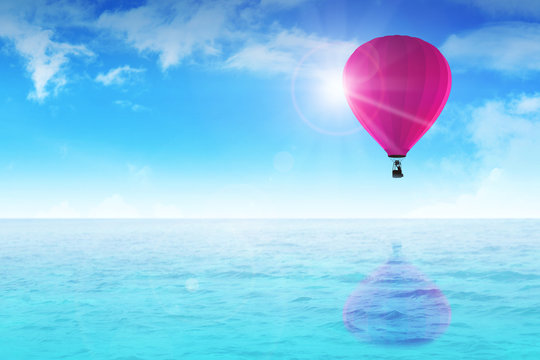 An air balloon floating on blue water