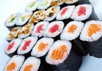 Roll made salmon, eel, tuna, vegetables