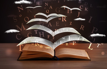 Pages and glowing letters flying out of a book