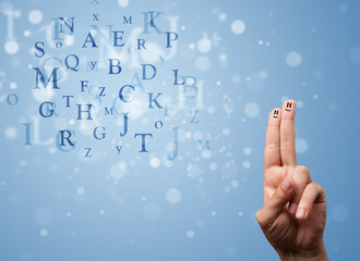 Happy smiley fingers looking at mixture of bokeh letters