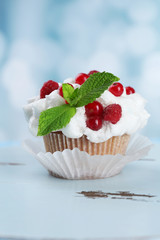 Tasty cupcake on table, close up