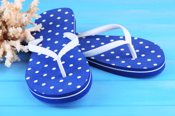 Color flip-flops on wooden background
