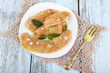 Sweetened fried banana on plate, close-up