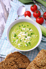 Leek soup on table, close up