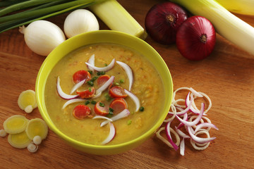 Leek soup on table, close up